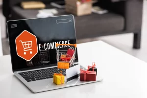 A laptop with the word e-commerce on it.